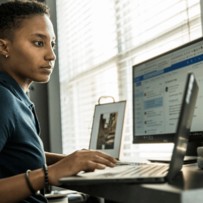 Woman sitting at her computer and online shopping during COVID-19